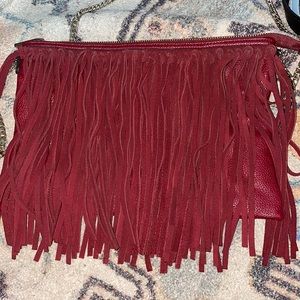 Red burgundy bag with tassels and gold chain
